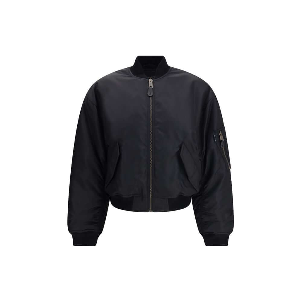 Black Polyamide BomberThe Standard Bomber offers a refined take on a timeless staple. Crafted from recycled satin-finish polyamide, it features ruched sleeves that add volume and character to the silhouette. A central zip closure and ribbed trims highligh