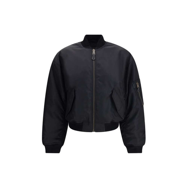 Black Polyamide BomberThe Standard Bomber offers a refined take on a timeless staple. Crafted from recycled satin-finish polyamide, it features ruched sleeves that add volume and character to the silhouette. A central zip closure and ribbed trims highligh