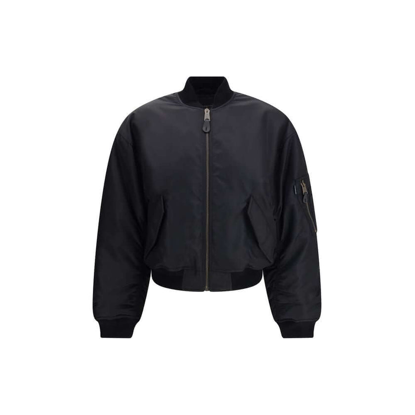 Black Polyamide BomberThe Standard Bomber offers a refined take on a timeless staple. Crafted from recycled satin-finish polyamide, it features ruched sleeves that add volume and character to the silhouette. A central zip closure and ribbed trims highligh