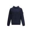 HoodieThe Stone Island Hoodie is an iconic garment with a casual, contemporary style. Featuring a ribbed hem and cuffs, it ensures comfort and a perfect fit. The distinctive detail is the brand’s logo patch applied on the right sleeve, a symbol of authent