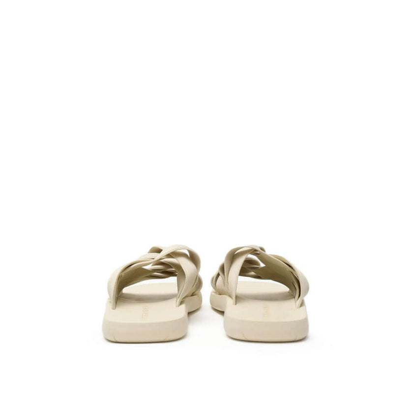Beige Fabric SlippersBottega Veneta Beige Elastic Woven Rubber Slipper Sandals. In sand beige, rounded rubber sole, tone-on-tone elastic weave. Composition: Technical fabric, rubber. Internal SKU: 25OTT04 Brand SKU: 651402V0GV09031Beige Fabric Slippers${t