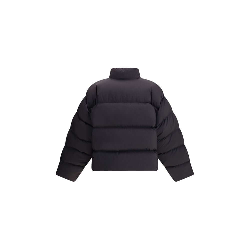 Black Polyamide ClothingThe Balenciaga Standard Puffer in Black is a contemporary wardrobe essential. Crafted from lightweight matte nylon, it features a cocoon-like volume, high straight collar, concealed zip with snap-button placket, two slanted pockets