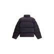 Black Polyamide ClothingThe Balenciaga Standard Puffer in Black is a contemporary wardrobe essential. Crafted from lightweight matte nylon, it features a cocoon-like volume, high straight collar, concealed zip with snap-button placket, two slanted pockets