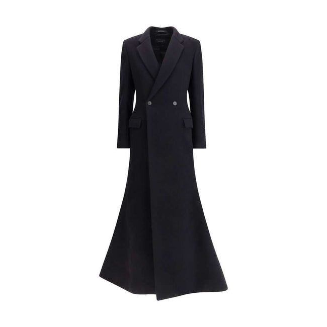 Black Wool CoatThe oversized double-breasted Coat by Balenciaga is an icon of contemporary elegance, blending sartorial precision with bold proportions. Crafted from a luxurious black wool and cashmere blend, it features a wide, structured silhouette enha