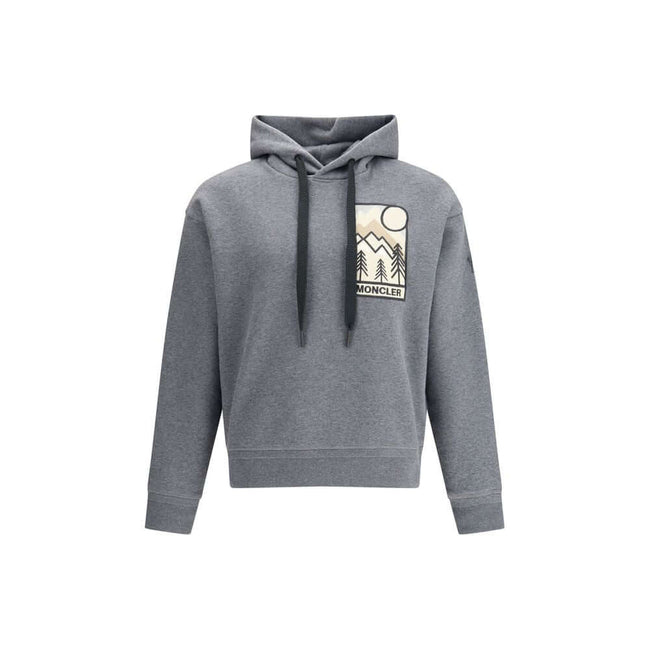 Gray Cotton SweatshirtThe Moncler Grenoble mountain-logo Hoodie blends functionality with sporty elegance. Crafted from soft cotton-blend fleece, it features a relaxed silhouette, an adjustable hood, and an embroidered logo patch on the chest, evoking the