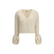 Cream Alpaca Vicugna Pacos CardiganThe V-neck cardigan by Moncler is reimagined with a contemporary twist through refined textures. Crafted from a luxurious blend of nylon, wool, alpaca, and mohair, it features a distinctive cable and Aran knit that adds
