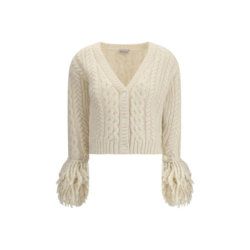 Cream Alpaca Vicugna Pacos CardiganThe V-neck cardigan by Moncler is reimagined with a contemporary twist through refined textures. Crafted from a luxurious blend of nylon, wool, alpaca, and mohair, it features a distinctive cable and Aran knit that adds