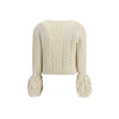 Cream Alpaca Vicugna Pacos CardiganThe V-neck cardigan by Moncler is reimagined with a contemporary twist through refined textures. Crafted from a luxurious blend of nylon, wool, alpaca, and mohair, it features a distinctive cable and Aran knit that adds
