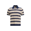 Multicolor Cotton Polo ShirtThe striped cotton Polo by Prada reimagines a menswear classic through the lens of the Maison’s refined aesthetic. Knitted from stretch cotton, it balances comfort and clean lines, enriched with solid-color details that highlig