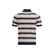 Multicolor Cotton Polo ShirtThe striped cotton Polo by Prada reimagines a menswear classic through the lens of the Maison’s refined aesthetic. Knitted from stretch cotton, it balances comfort and clean lines, enriched with solid-color details that highlig