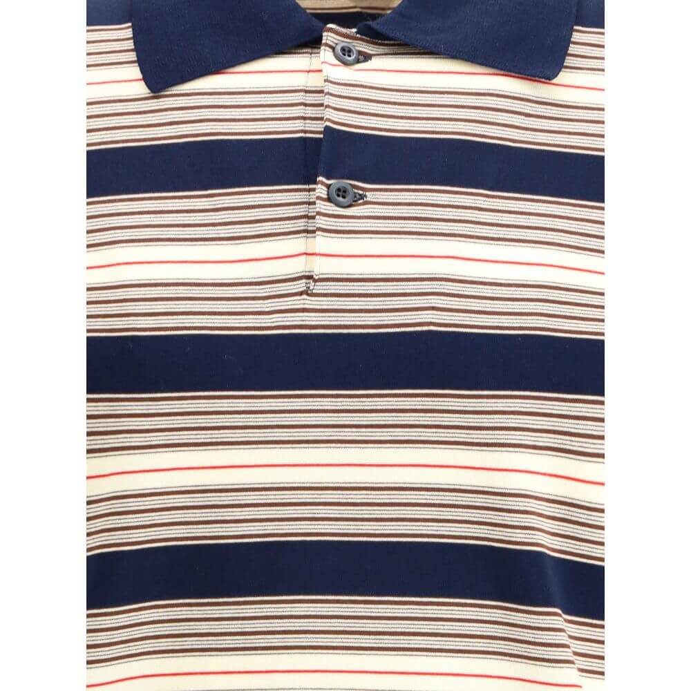Multicolor Cotton Polo ShirtThe striped cotton Polo by Prada reimagines a menswear classic through the lens of the Maison’s refined aesthetic. Knitted from stretch cotton, it balances comfort and clean lines, enriched with solid-color details that highlig