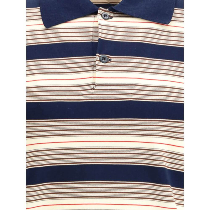 Multicolor Cotton Polo ShirtThe striped cotton Polo by Prada reimagines a menswear classic through the lens of the Maison’s refined aesthetic. Knitted from stretch cotton, it balances comfort and clean lines, enriched with solid-color details that highlig
