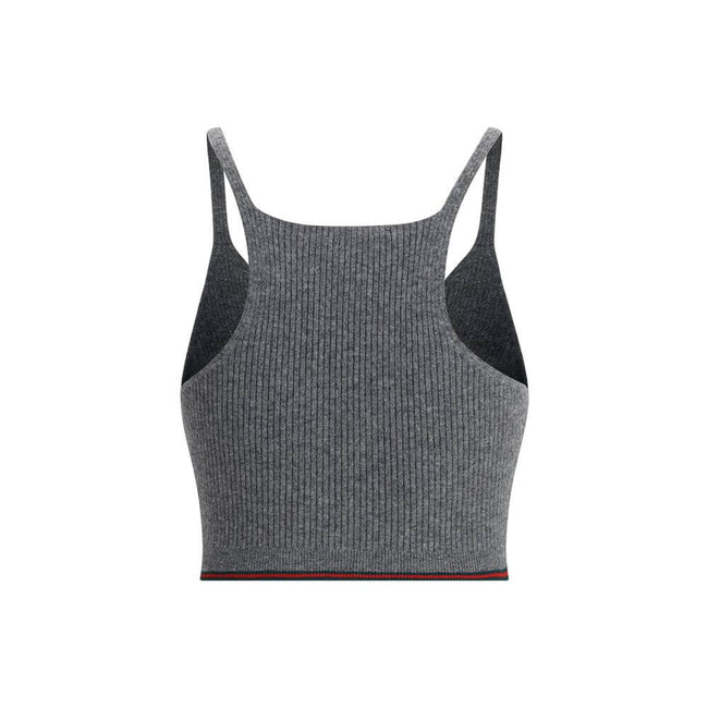 Gray Wool TopThe V-neck ribbed Top by Gucci elevates the simplicity of ribbed knitwear with the narrative power of the maison’s signature green and red Web trim. Essential lines meet iconic detailing, turning a wardrobe staple into an unmistakable style s