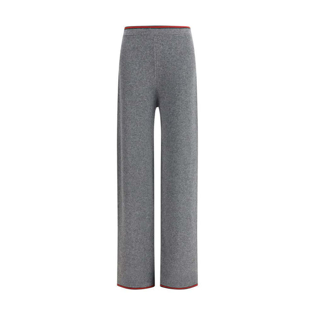 Gray Wool Casual PantsThe ribbed Wool Trousers by Gucci highlight the House’s signature codes with the green and red Web trim accenting the waistband and hem. Cut with a wide leg for a relaxed yet refined silhouette, the trousers feature an elasticated wa