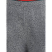 Gray Wool Casual PantsThe ribbed Wool Trousers by Gucci highlight the House’s signature codes with the green and red Web trim accenting the waistband and hem. Cut with a wide leg for a relaxed yet refined silhouette, the trousers feature an elasticated wa