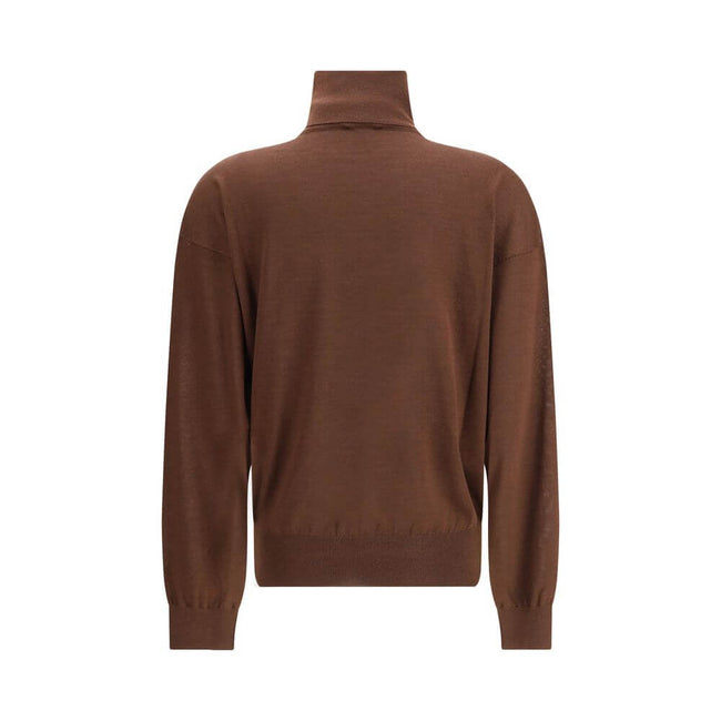 Brown Cashmere TurtleneckThe Turtleneck Pullover in Cashmere, Wool, and Silk by Saint Laurent is a refined and enveloping piece that combines comfort with understated luxury. Designed with a relaxed fit and dropped shoulders, it features ribbed finishes t
