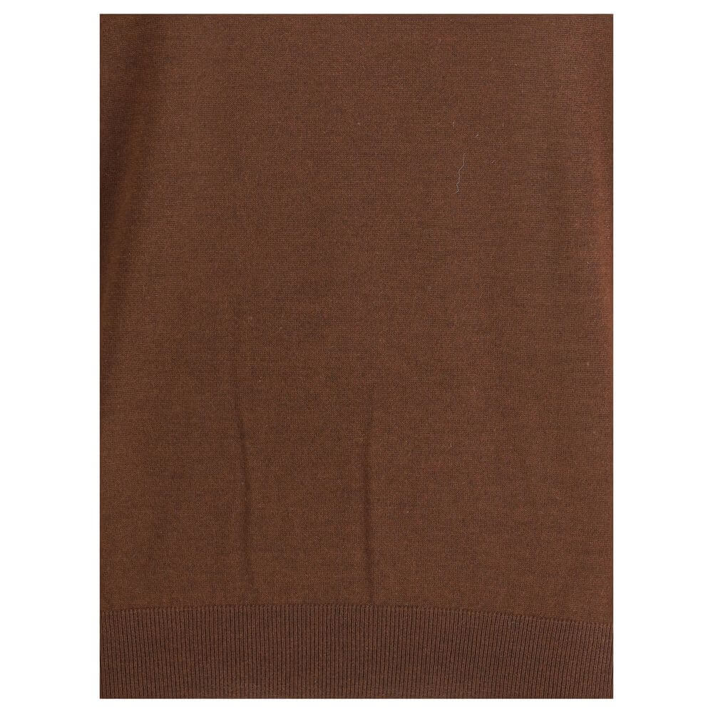 Brown Cashmere TurtleneckThe Turtleneck Pullover in Cashmere, Wool, and Silk by Saint Laurent is a refined and enveloping piece that combines comfort with understated luxury. Designed with a relaxed fit and dropped shoulders, it features ribbed finishes t