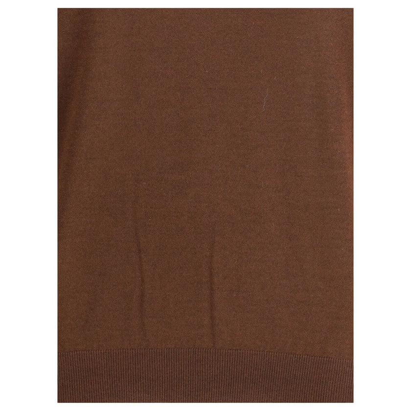Brown Cashmere TurtleneckThe Turtleneck Pullover in Cashmere, Wool, and Silk by Saint Laurent is a refined and enveloping piece that combines comfort with understated luxury. Designed with a relaxed fit and dropped shoulders, it features ribbed finishes t