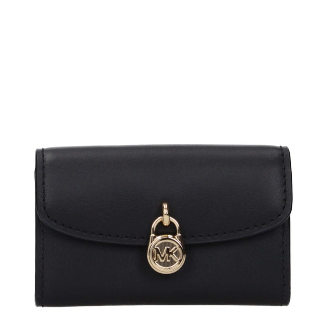 Black Leather WalletDescription: The product with MPN 35S5G1YE0LBLACK and code F85049 leather in black is a coin purses designed by Michael Kors. It has features like front detail, front logo, external pocket.Black Leather Wallet${tagsMichael KorsAulae Bl