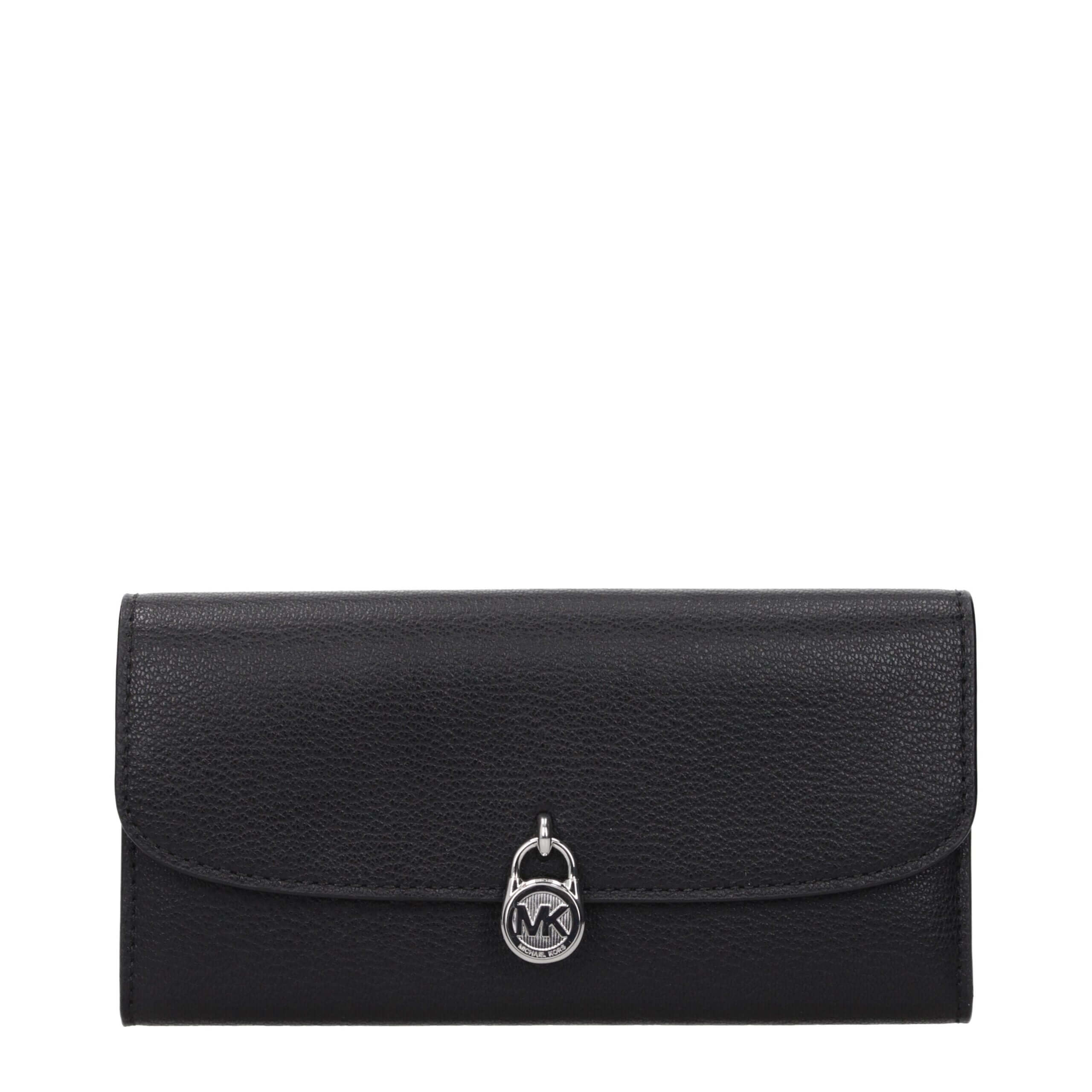 Black Leather WalletDescription: The product with MPN 35S5SHME9LBLACK and code F85082 leather in black is a wallets designed by Michael Kors. It has features like front logo, front detail, external pocket.Black Leather Wallet${tagsMichael KorsAulae Black