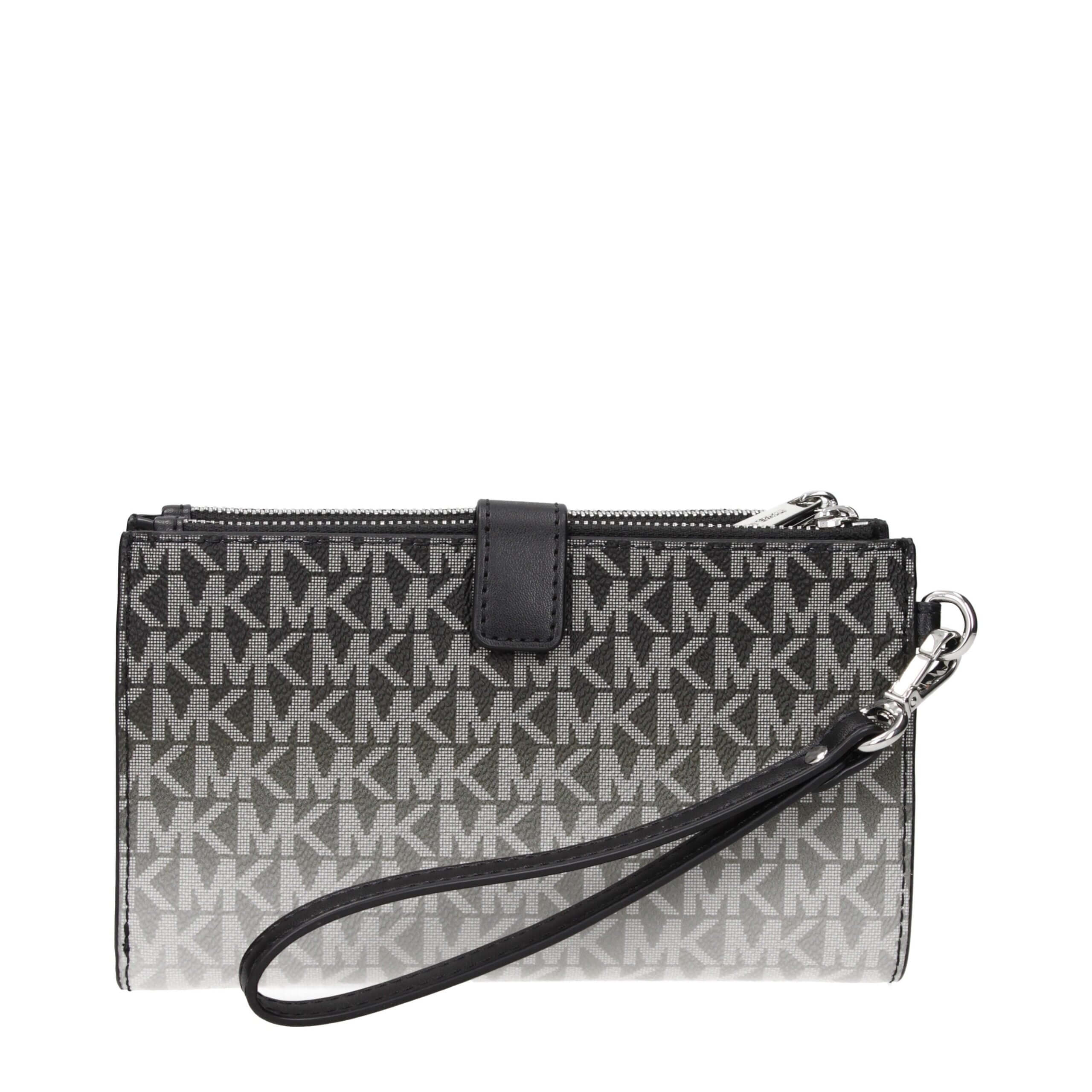 Black Fabric WalletDescription: The product with MPN 35R5STVW3VBLACK and code F85085 fabric in black is a wallets designed by Michael Kors. It has features like logo, removable handle.Black Fabric Wallet${tagsMichael KorsAulae Black Fabric Wallet Michael