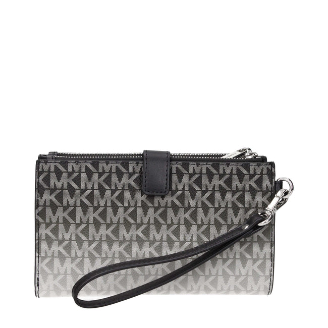 Black Fabric WalletDescription: The product with MPN 35R5STVW3VBLACK and code F85085 fabric in black is a wallets designed by Michael Kors. It has features like logo, removable handle.Black Fabric Wallet${tagsMichael KorsAulae Black Fabric Wallet Michael