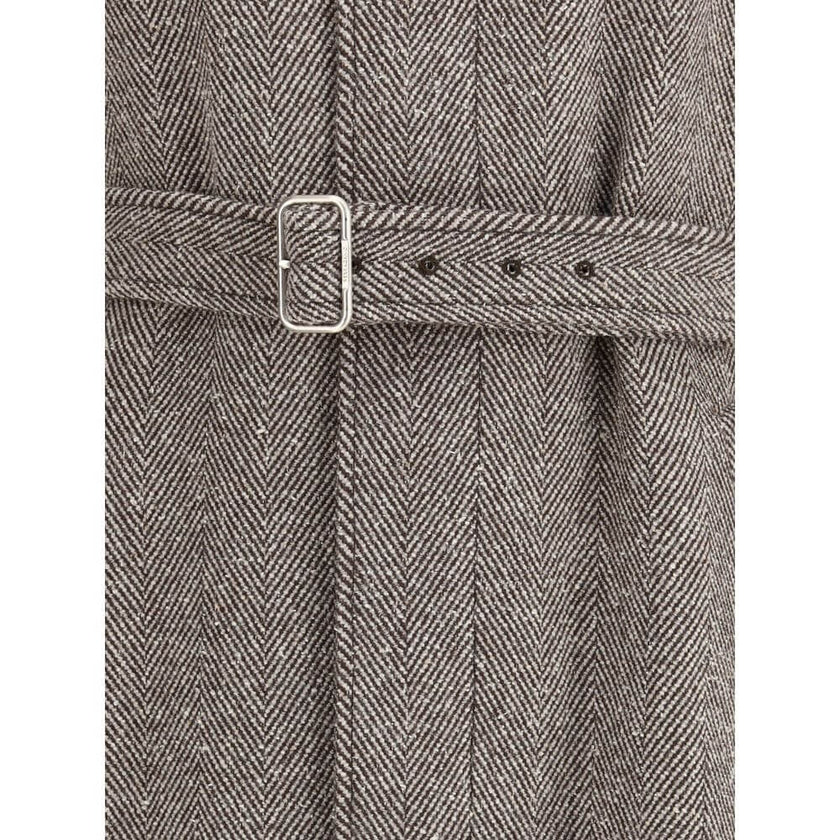 Beige Wool CoatThe Coat by Ferragamo is crafted from a refined herringbone-patterned fabric, showcasing timeless sophistication. It features a button-front closure and two front welt pockets. The structured collar includes an additional internal fastening