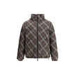 Brown Polyester CoatThe Reversible Check Snowdon Puffer Jacket by Burberry is a down-filled jacket crafted from goose down and feathers, cut to a relaxed fit for comfort and ease. Its reversible design transitions from the classic Burberry Check to a soli