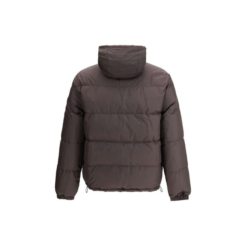 Brown Polyester CoatThe Reversible Check Snowdon Puffer Jacket by Burberry is a down-filled jacket crafted from goose down and feathers, cut to a relaxed fit for comfort and ease. Its reversible design transitions from the classic Burberry Check to a soli