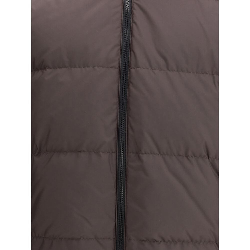 Brown Polyester CoatThe Reversible Check Snowdon Puffer Jacket by Burberry is a down-filled jacket crafted from goose down and feathers, cut to a relaxed fit for comfort and ease. Its reversible design transitions from the classic Burberry Check to a soli
