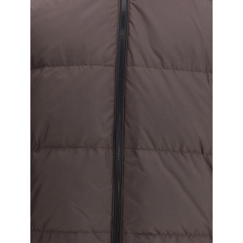 Brown Polyester CoatThe Reversible Check Snowdon Puffer Jacket by Burberry is a down-filled jacket crafted from goose down and feathers, cut to a relaxed fit for comfort and ease. Its reversible design transitions from the classic Burberry Check to a soli