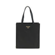 Black Recycled Polyamide Shoulder BagRe-Nylon Tote Bag by Prada features a functional and elegant design. Equipped with two leather handles, it features the iconic triangular plaque on the front and an adjustable and removable nylon shoulder strap for add