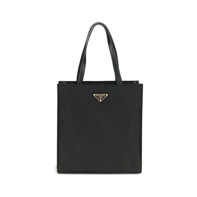 Black Recycled Polyamide Shoulder BagRe-Nylon Tote Bag by Prada features a functional and elegant design. Equipped with two leather handles, it features the iconic triangular plaque on the front and an adjustable and removable nylon shoulder strap for add