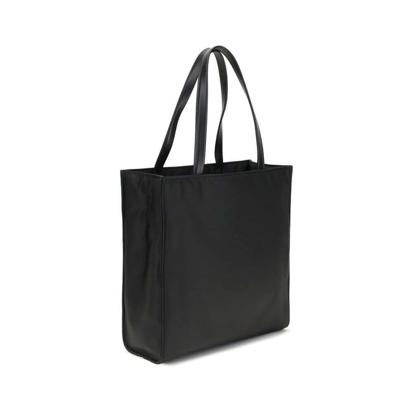 Black Recycled Polyamide Shoulder BagRe-Nylon Tote Bag by Prada features a functional and elegant design. Equipped with two leather handles, it features the iconic triangular plaque on the front and an adjustable and removable nylon shoulder strap for add