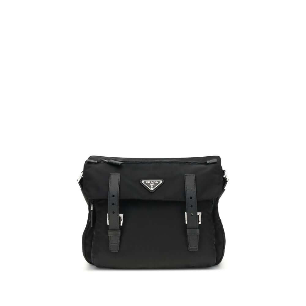 Black Polyamide Shoulder BagExplore medium Shoulder Bag by Prada is made of Re-Nylon and finished with metal details. It features a front zippered pocket, enameled triangle logo flap, and zipper and strap closure. The interior, also made of Re-Nylon, incl