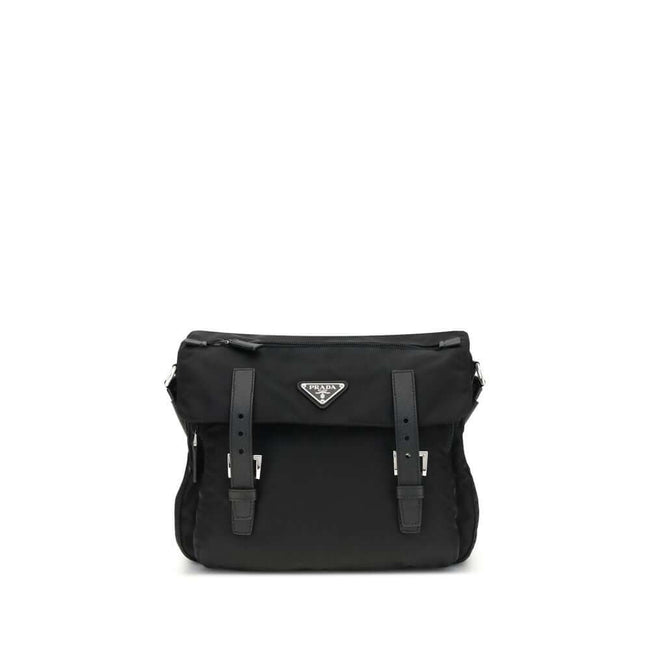 Black Polyamide Shoulder BagExplore medium Shoulder Bag by Prada is made of Re-Nylon and finished with metal details. It features a front zippered pocket, enameled triangle logo flap, and zipper and strap closure. The interior, also made of Re-Nylon, incl