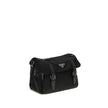 Black Polyamide Shoulder BagExplore medium Shoulder Bag by Prada is made of Re-Nylon and finished with metal details. It features a front zippered pocket, enameled triangle logo flap, and zipper and strap closure. The interior, also made of Re-Nylon, incl