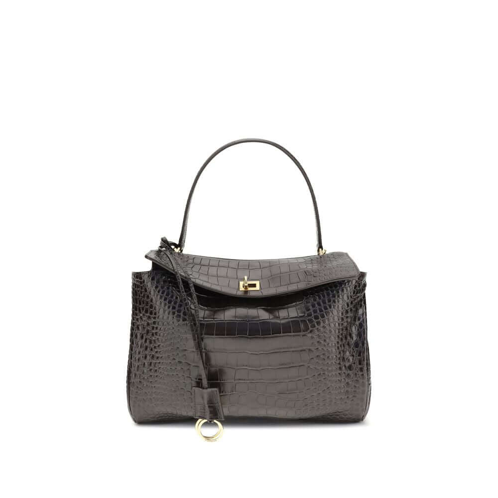 Brown Calf Leather Bos Taurus HandbagLeather Medium Rodeo Handbag by Balenciaga, single removable top handle, charm with key ring detail applied at base of handle, dual compartment, flap closure with swivel system at front, crocodile-effect leather design
