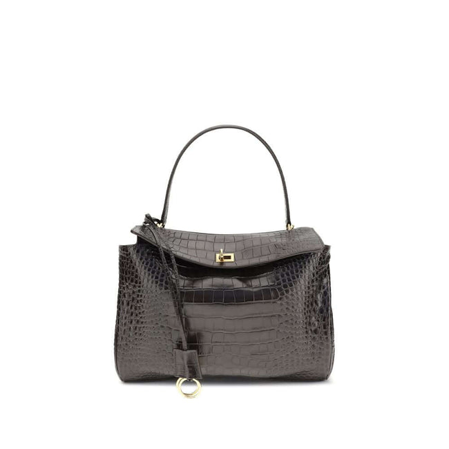 Brown Calf Leather Bos Taurus HandbagLeather Medium Rodeo Handbag by Balenciaga, single removable top handle, charm with key ring detail applied at base of handle, dual compartment, flap closure with swivel system at front, crocodile-effect leather design