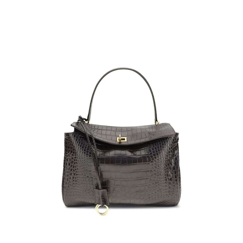 Brown Calf Leather Bos Taurus HandbagLeather Medium Rodeo Handbag by Balenciaga, single removable top handle, charm with key ring detail applied at base of handle, dual compartment, flap closure with swivel system at front, crocodile-effect leather design