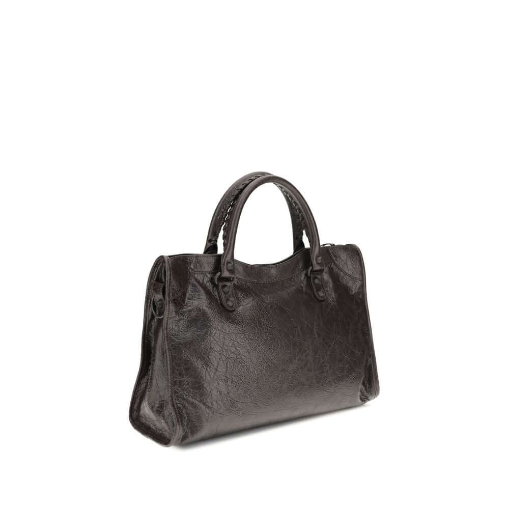 Brown Calf Leather Bos Taurus Shoulder BagBalenciaga’s Le City Medium Shoulder Bag is a high-class item made of fine lambskin leather that combines elegance and functionality. The two hand-woven leather handles lend an artisanal and refined touch, while t