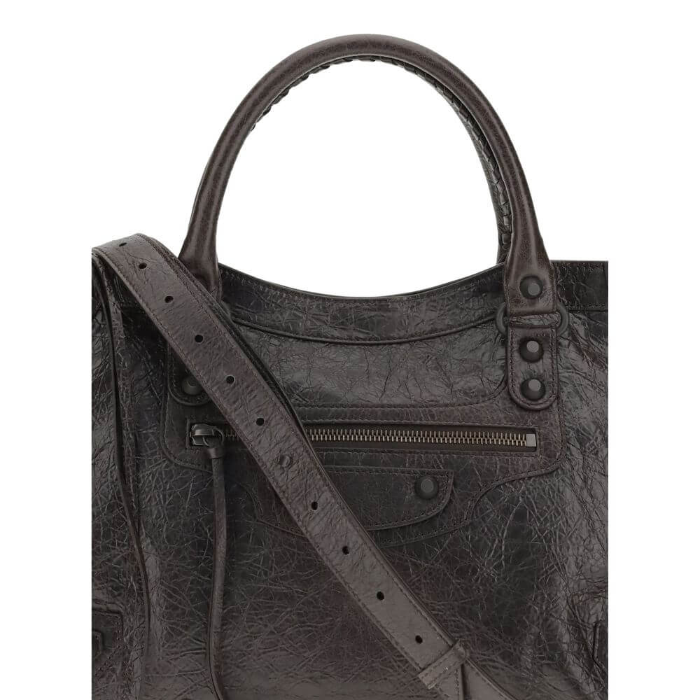 Brown Calf Leather Bos Taurus Shoulder BagBalenciaga’s Le City Medium Shoulder Bag is a high-class item made of fine lambskin leather that combines elegance and functionality. The two hand-woven leather handles lend an artisanal and refined touch, while t