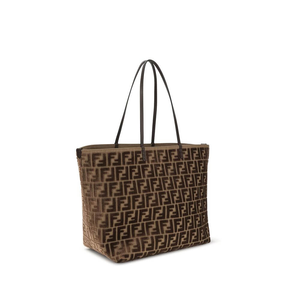 Brown Fabric Shoulder BagTote Bag by Fendi is made with the iconic FF all-over printed chenille pattern, creating a luxurious and sophisticated effect. Featuring two flat leather handles, this bag combines practicality and elegance. The interior features