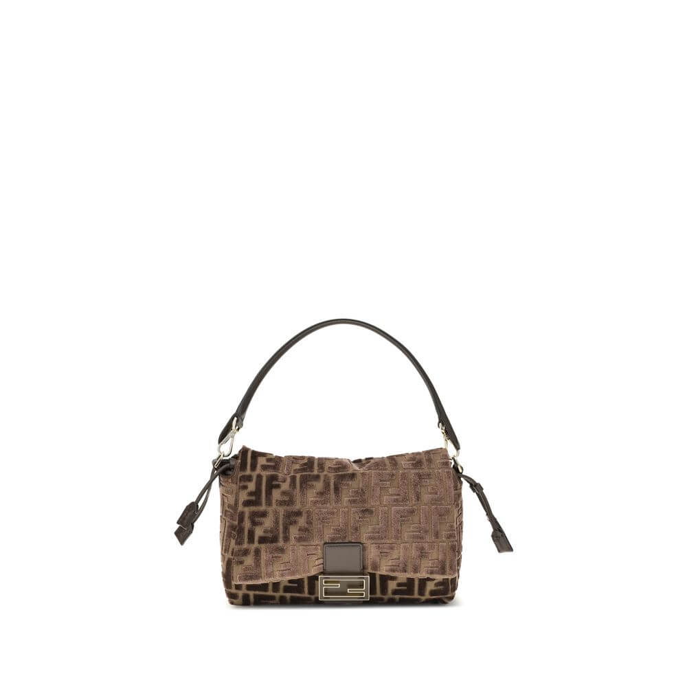 Brown Viscose Shoulder BagMedium Mamma Baguette Shoulder Bag by Fendi is made of jacquard velvet with a dark brown embossed FF pattern on a brown base. It is decorated with an FF closure with tone-on-tone leather insert and features a front flap with magn