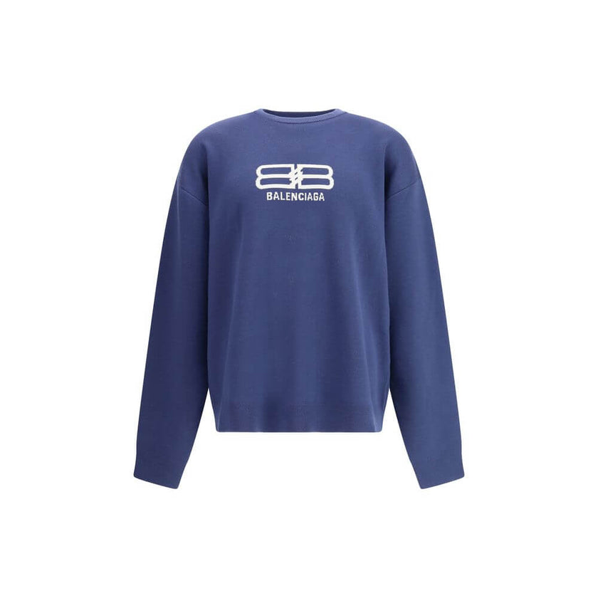 Blue Wool SweatshirtThe crewneck Sweatshirt by Balenciaga embodies the brand’s modern and minimalist aesthetic. Crafted from soft cotton, it features a relaxed fit, long sleeves, and a contrasting logo printed at the front, adding a signature touch to its