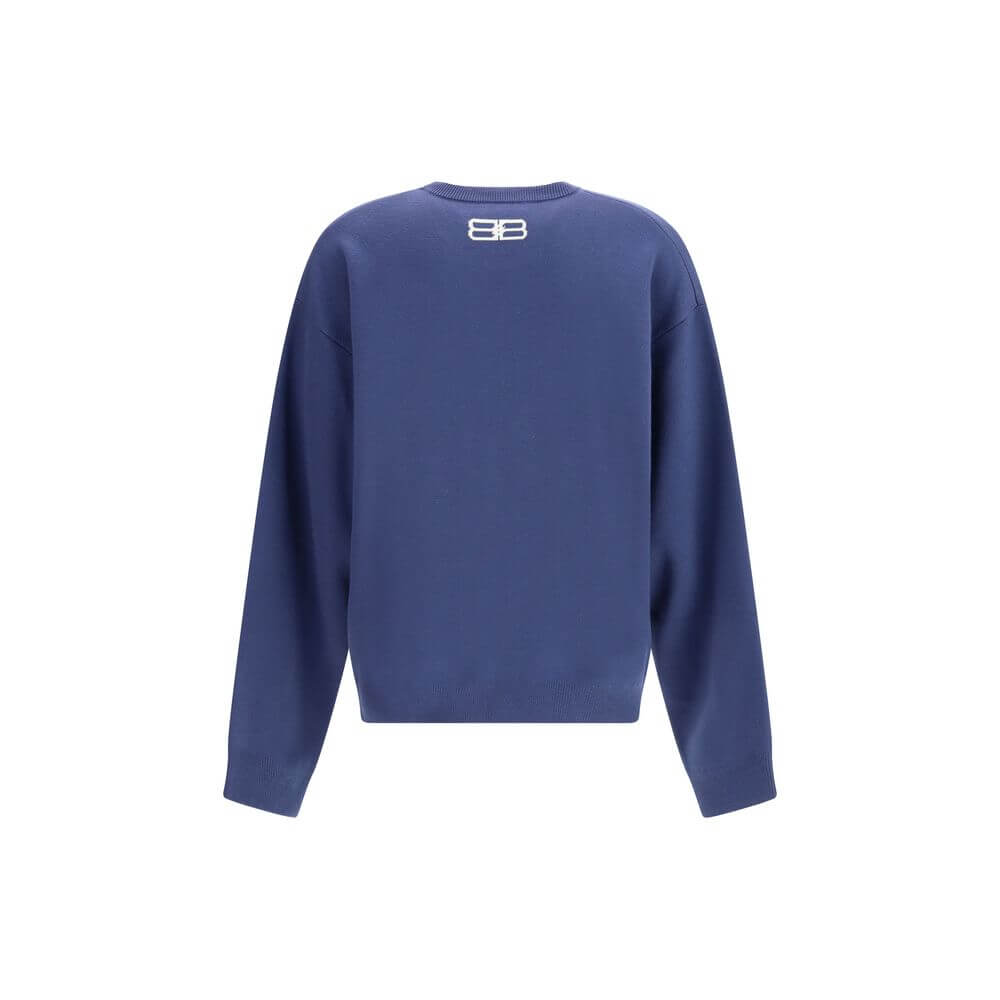 Blue Wool SweatshirtThe crewneck Sweatshirt by Balenciaga embodies the brand’s modern and minimalist aesthetic. Crafted from soft cotton, it features a relaxed fit, long sleeves, and a contrasting logo printed at the front, adding a signature touch to its