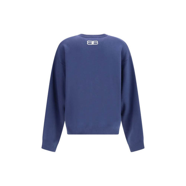 Blue Wool SweatshirtThe crewneck Sweatshirt by Balenciaga embodies the brand’s modern and minimalist aesthetic. Crafted from soft cotton, it features a relaxed fit, long sleeves, and a contrasting logo printed at the front, adding a signature touch to its