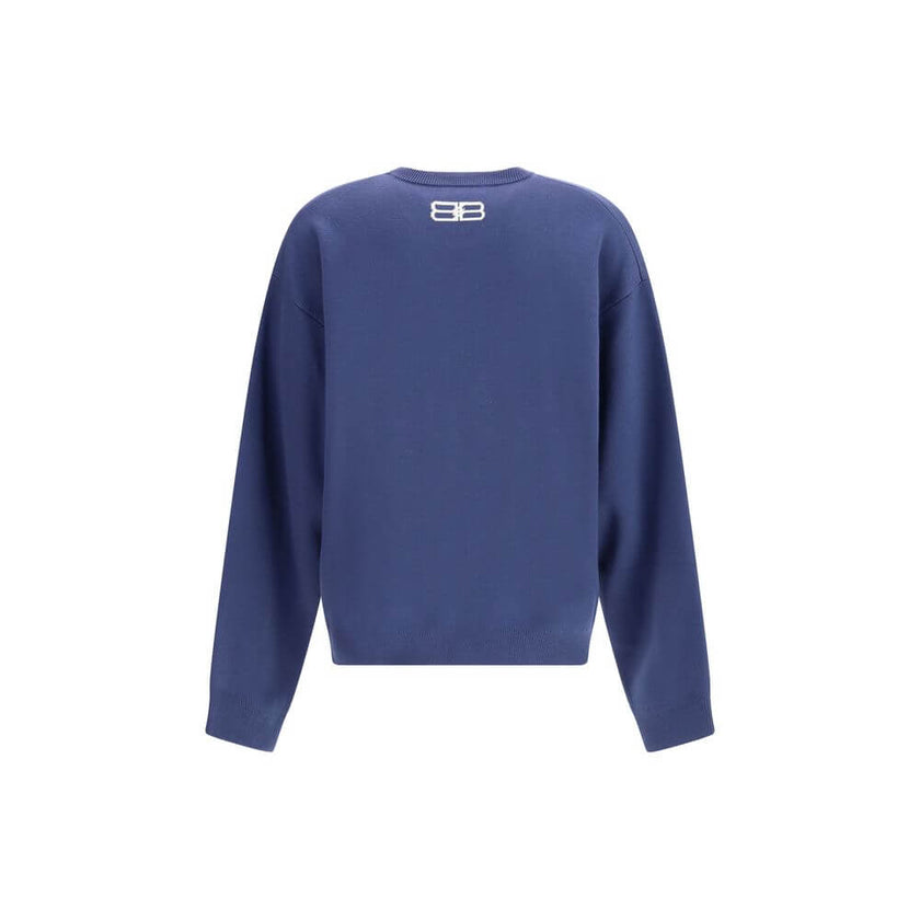 Blue Wool SweatshirtThe crewneck Sweatshirt by Balenciaga embodies the brand’s modern and minimalist aesthetic. Crafted from soft cotton, it features a relaxed fit, long sleeves, and a contrasting logo printed at the front, adding a signature touch to its