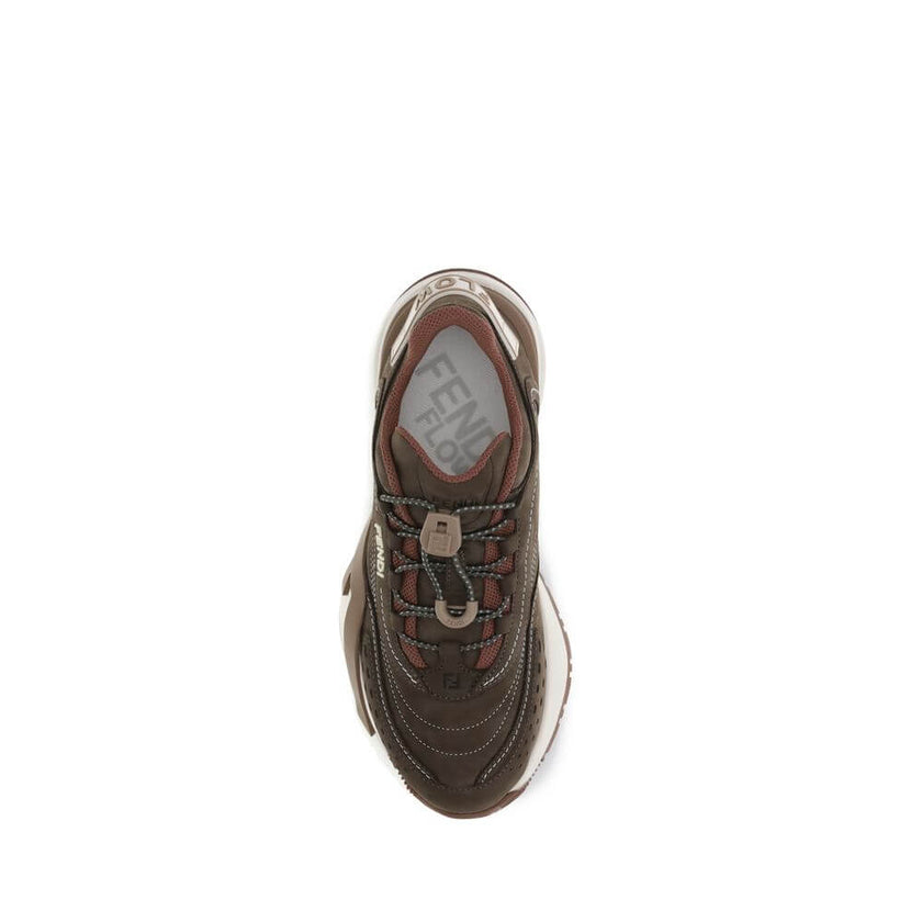 Brown Rubber Athletic SneakersFlow Mix Sneakers by Fendi combine sporty style and luxurious details in a dynamic and sophisticated design. Made of technical mesh with tone-on-tone suede and leather inserts, they feature an adjustable elastic lace-up closu