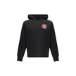Black Cotton SweatshirtThe cotton hooded Sweatshirt by Moncler is a timeless casual essential reimagined with a distinctive touch. Crafted from soft cotton jersey, it features an adjustable hood, ribbed trims, and the iconic star-shaped logo patch on the